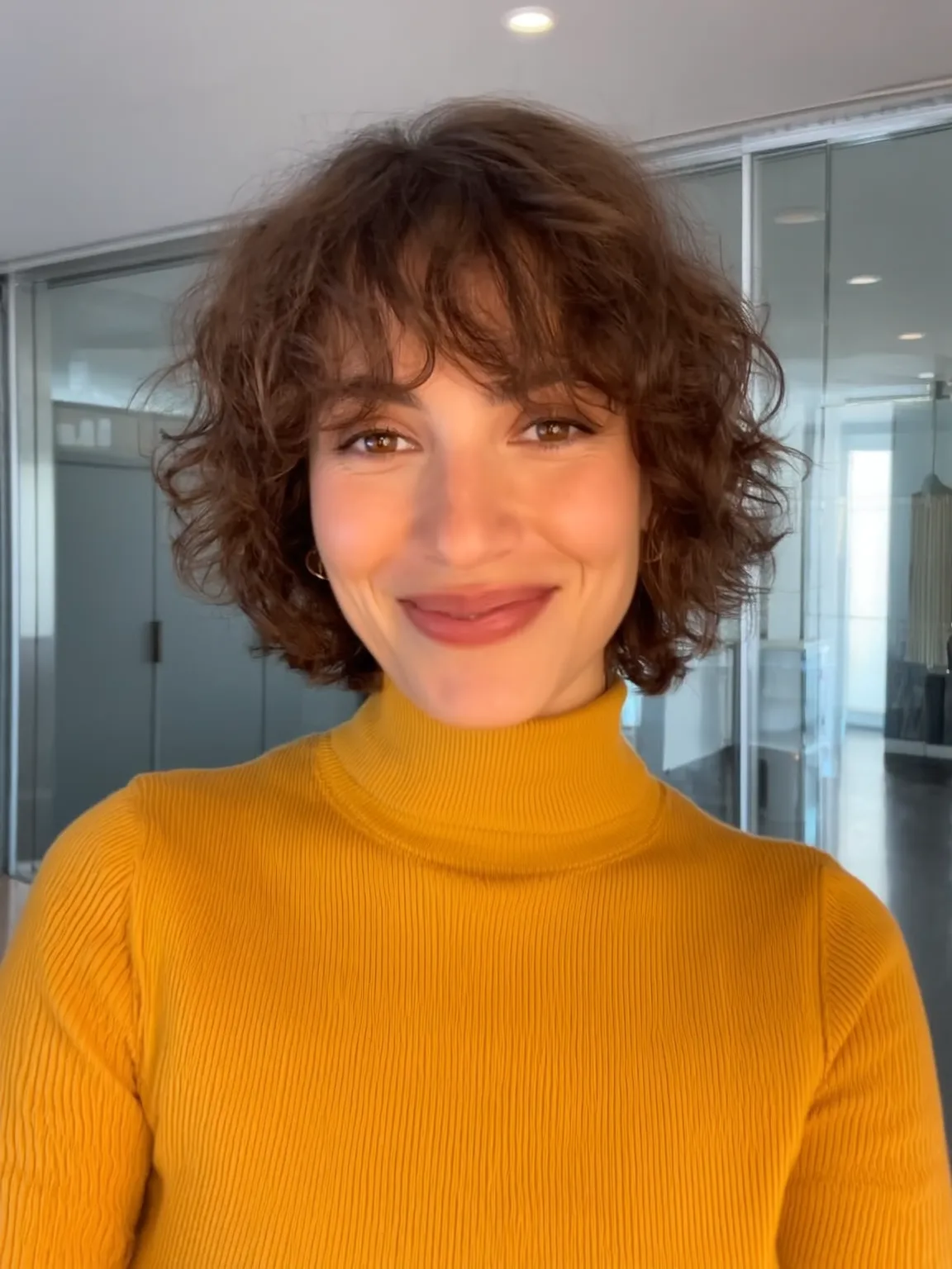 Voluminous Curly Bob with Wispy Bangs